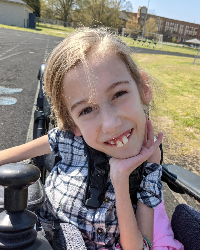 Callie in wheelchair at the track